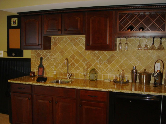 wet bar with sink and granite counter top