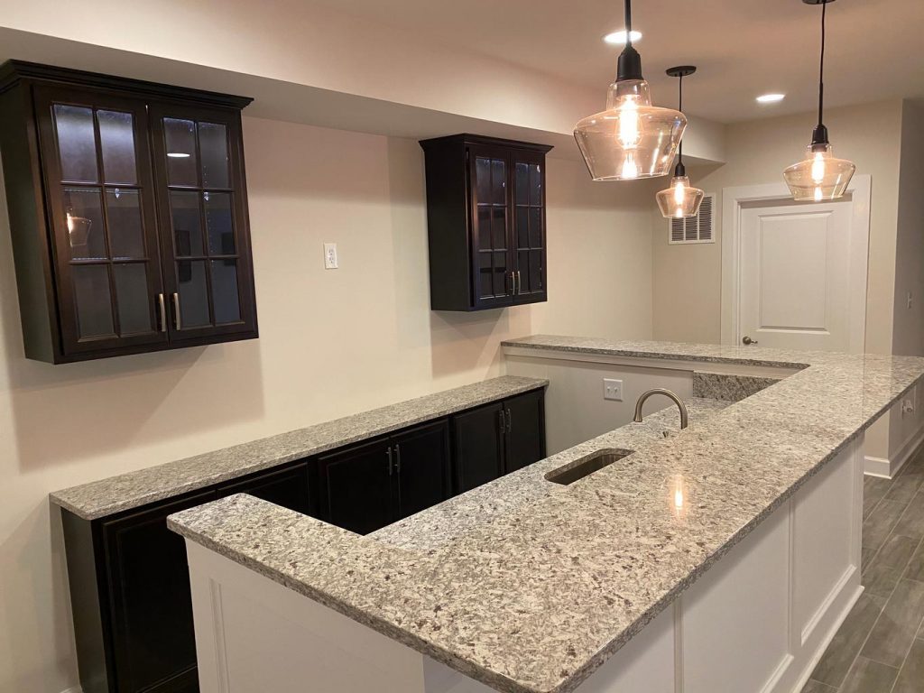 basement wet bar with sink and countertop